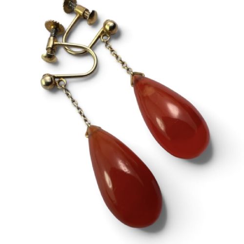 fig 1. Pair of Edwardian 9ct gold screw-back earrings featuring delicate chains suspending polished teardrop-shaped red agate drops.