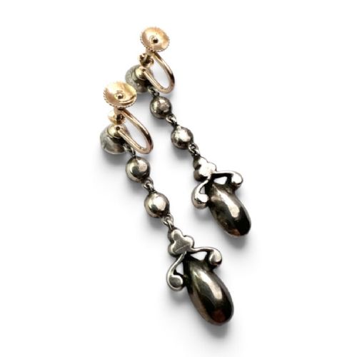 fig 1. A pair of Victorian gold and silver drop earrings set with light blue and clear paste stones.