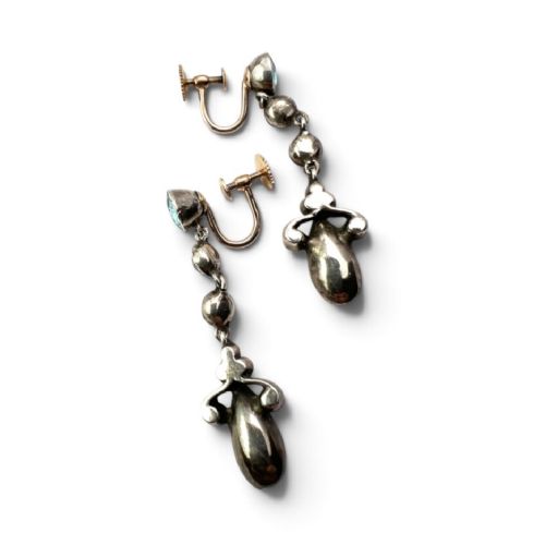 fig 2. A pair of Victorian gold and silver drop earrings set with light blue and clear paste stones.