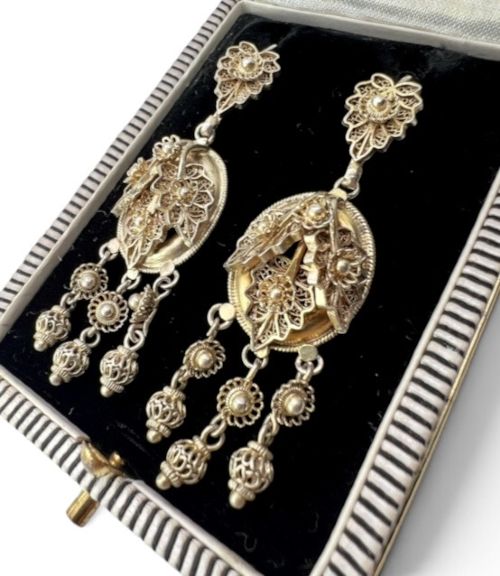 fig 1. A pair of Victorian gilded silver filigree girandole chandelier earrings with triple dangling drops, displayed inside a velvet presentation box.