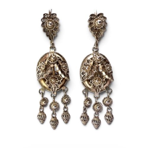 A pair of Victorian gilded silver filigree girandole chandelier earrings with triple dangling drops, displayed inside a velvet presentation box. View III
