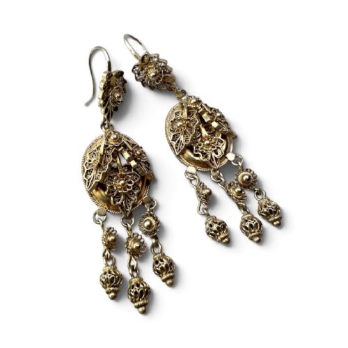 A pair of Victorian gilded silver filigree girandole chandelier earrings with triple dangling drops, displayed inside a velvet presentation box. View IV