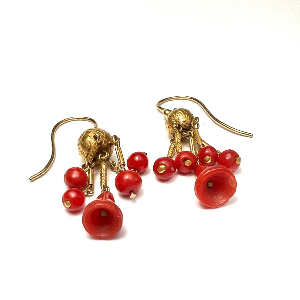 A pair of Victorian 15ct gold drop earrings featuring etched gold spheres suspended from wire hooks, with hanging gold bars, red coral beads, and bell-shaped coral drops. View III