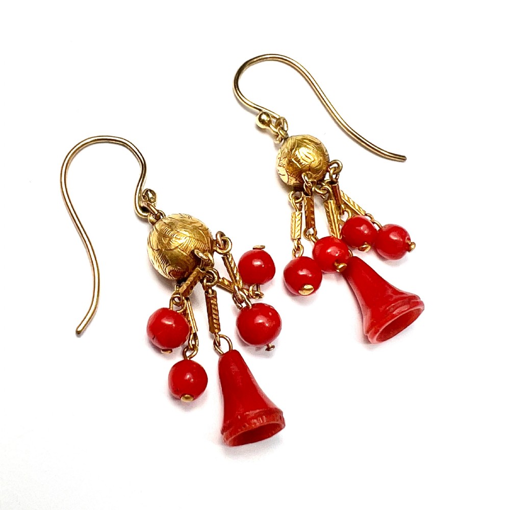 A pair of Victorian 15ct gold drop earrings featuring etched gold spheres suspended from wire hooks, with hanging gold bars, red coral beads, and bell-shaped coral drops. View IV