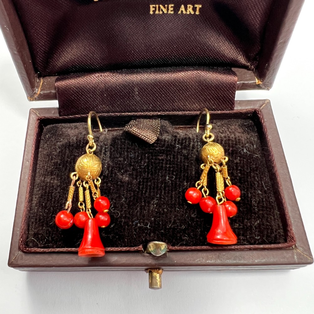 A pair of Victorian 15ct gold drop earrings featuring etched gold spheres suspended from wire hooks, with hanging gold bars, red coral beads, and bell-shaped coral drops. View VII