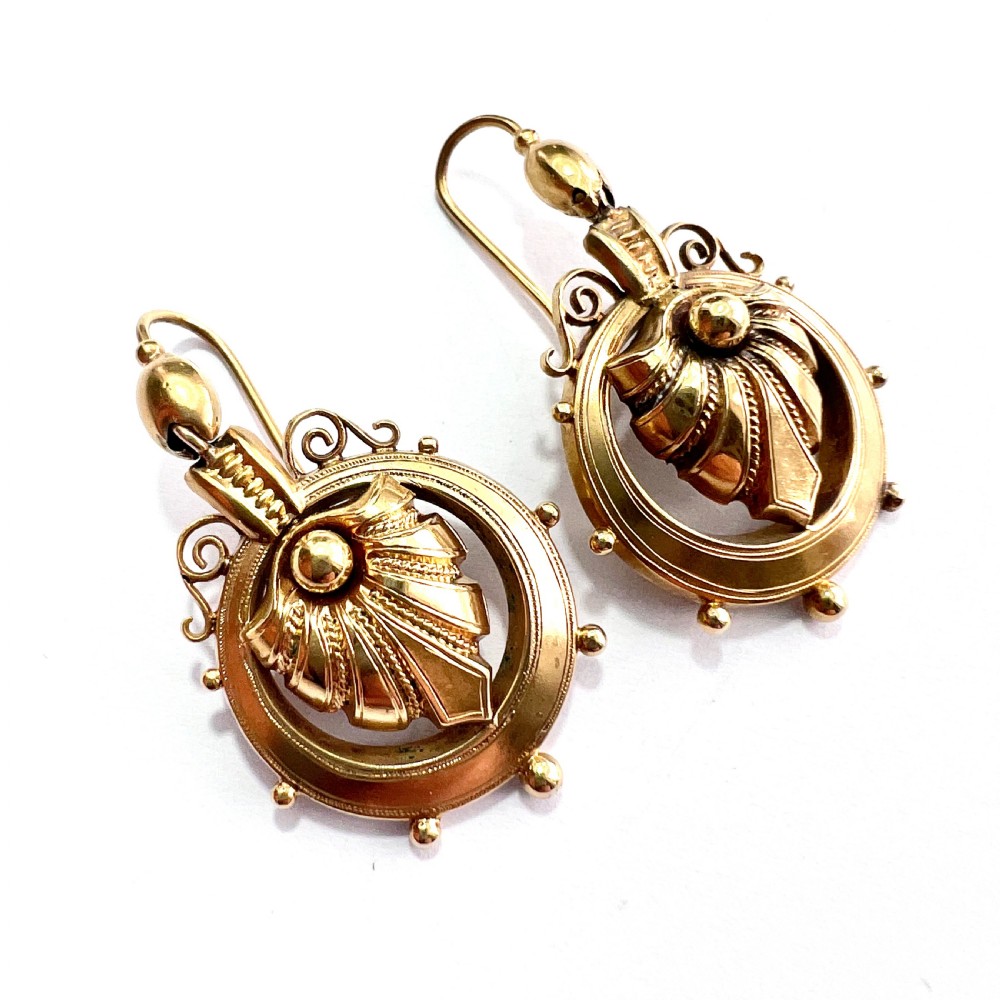 A pair of Victorian 18ct yellow gold drop earrings featuring detailed acanthus leaf motifs suspended within circular outer hoops. View XI