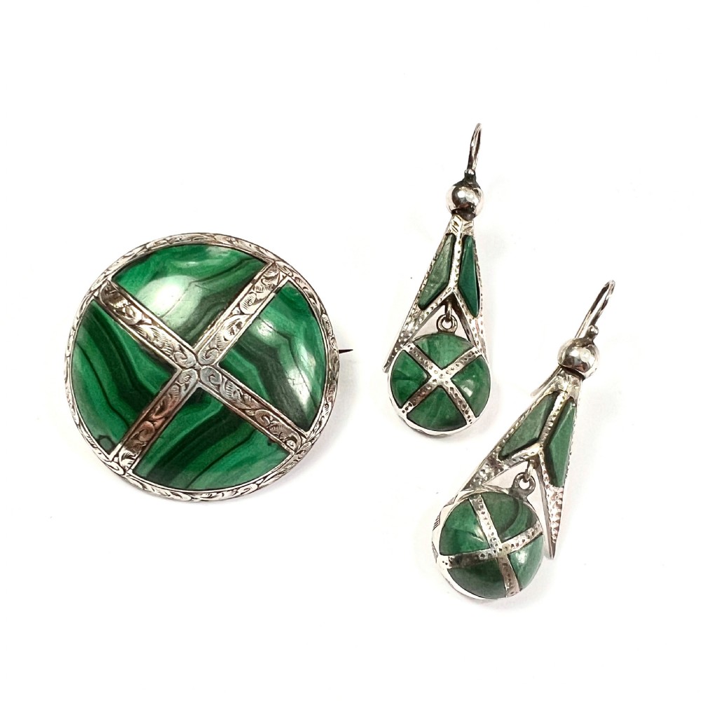 A Victorian Scottish silver jewellery suite comprising a circular brooch and drop earrings inlaid with banded green malachite. View III