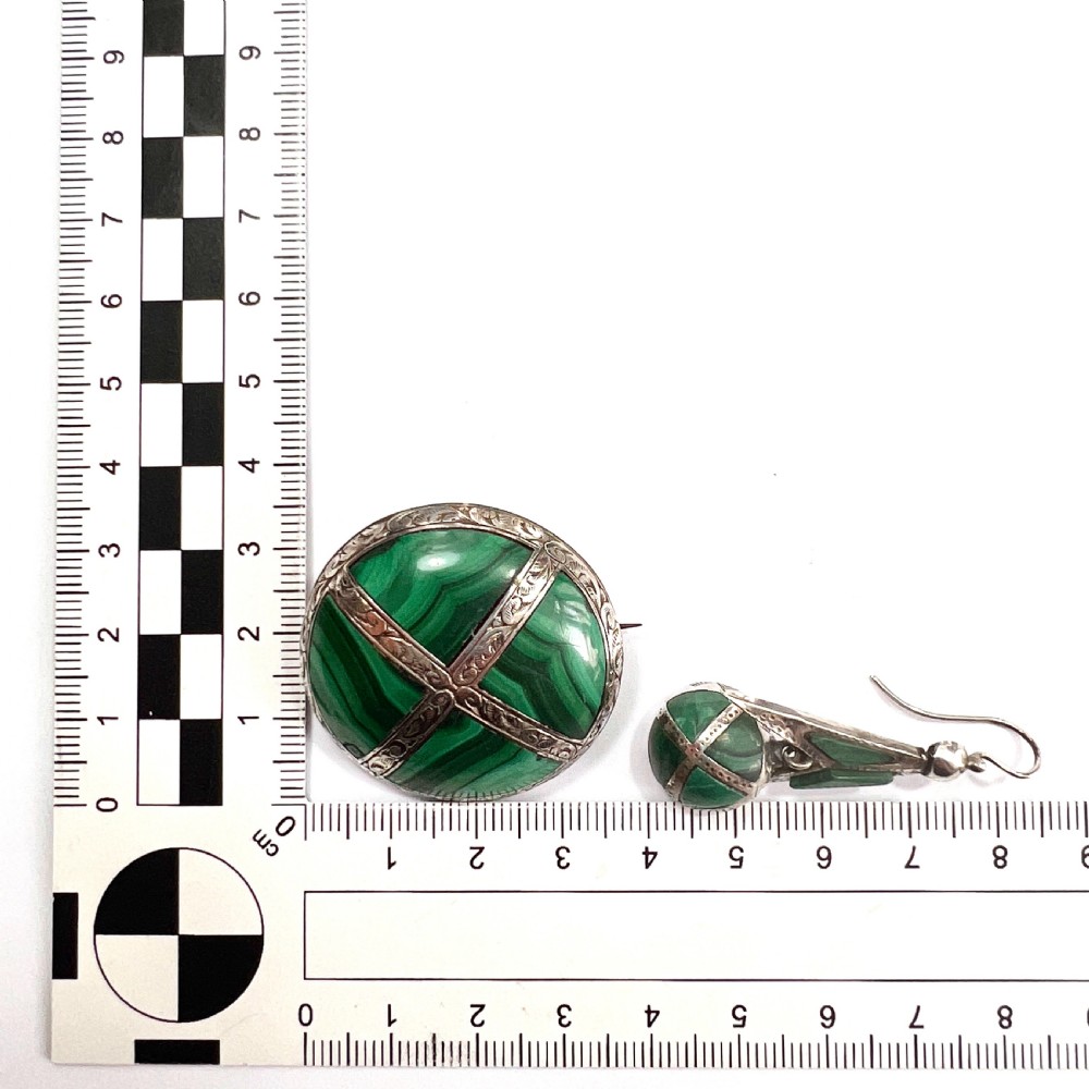 A Victorian Scottish silver jewellery suite comprising a circular brooch and drop earrings inlaid with banded green malachite. View VIII