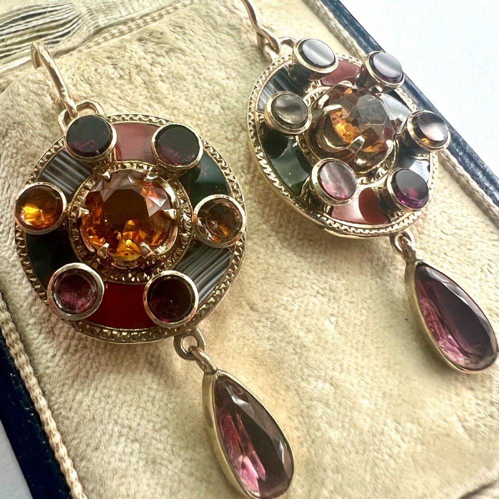 A pair of Victorian 9ct gold target drop earrings inlaid with patterned agates and surrounding central citrine gemstones. View III