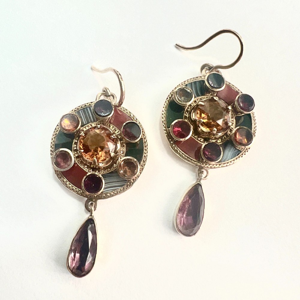 A pair of Victorian 9ct gold target drop earrings inlaid with patterned agates and surrounding central citrine gemstones. View V