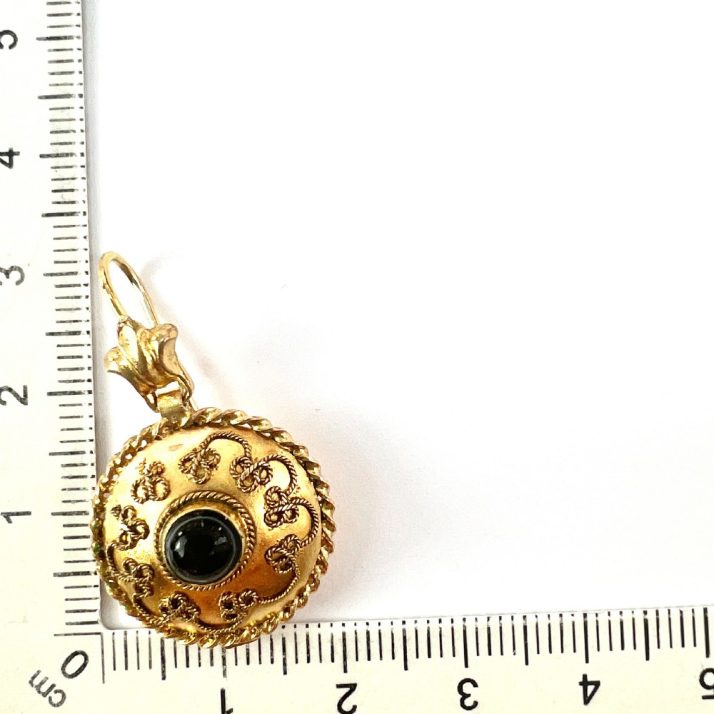 A pair of circular Victorian 15ct gold domed drop earrings featuring detailed scroll wirework, rope twist borders, and central dark agate cabochons. View IV