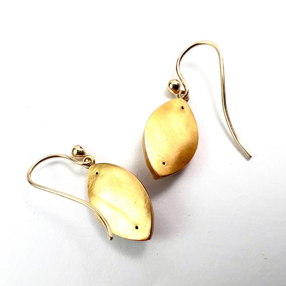 A pair of Victorian 9ct yellow gold marquise-shaped drop earrings featuring star-set diamond centres and engraved geometric detail. View III