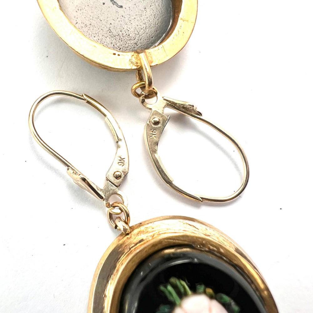 A pair of oval yellow gold drop earrings featuring micro mosaic floral designs with central pink roses on a black background. View VIII