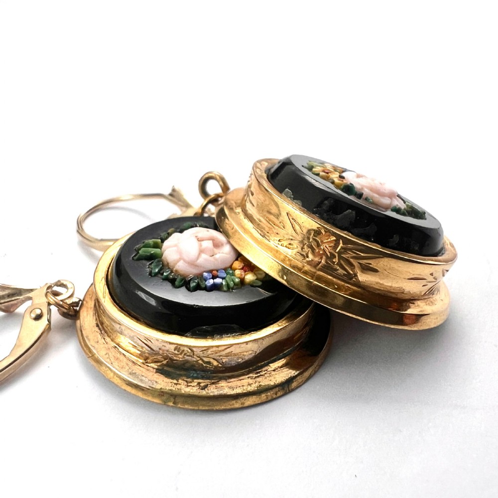 A pair of oval yellow gold drop earrings featuring micro mosaic floral designs with central pink roses on a black background. View IX