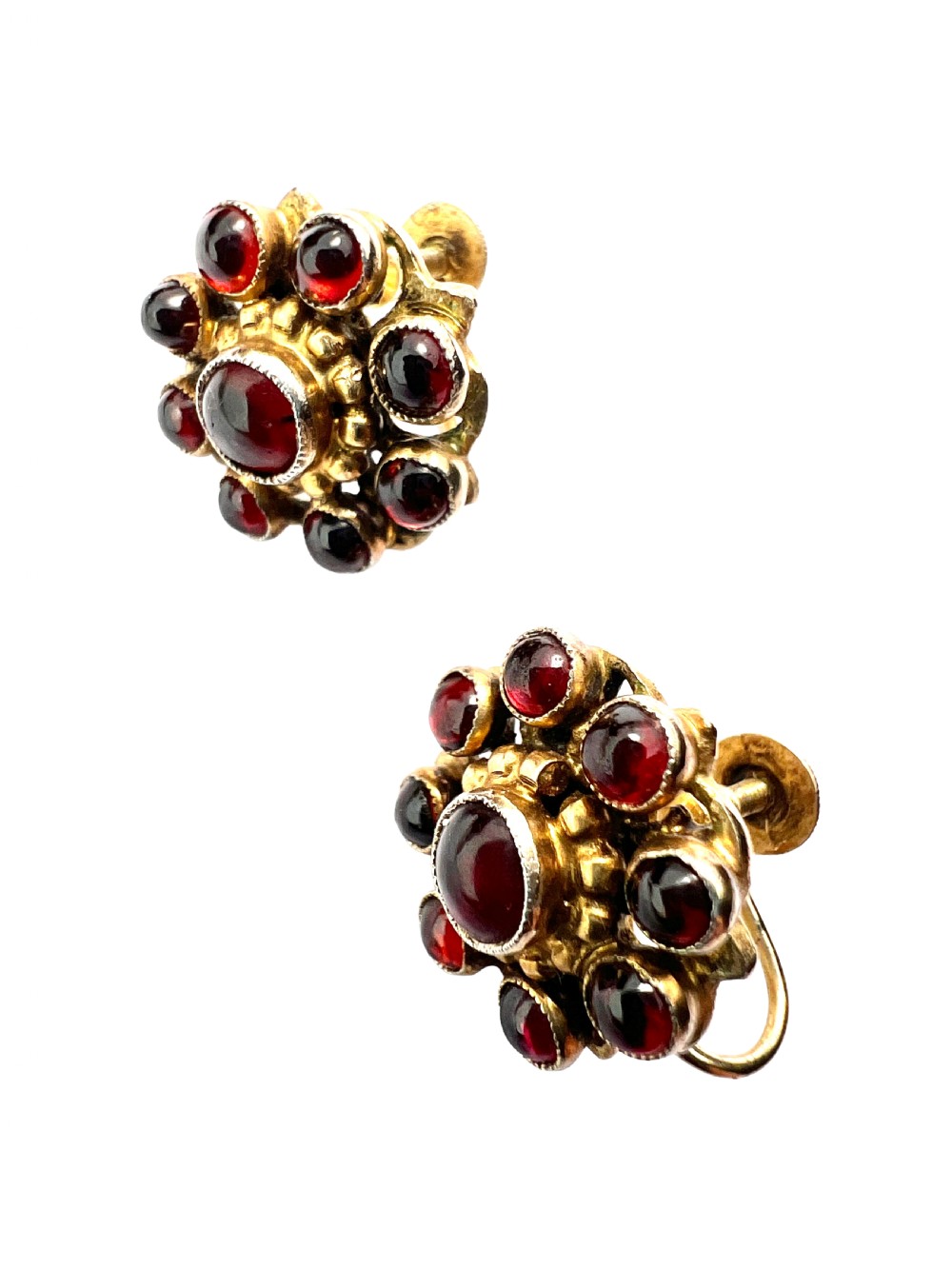 A pair of antique silver-gilt earrings set with deep red cabochon garnets arranged in a circular cluster halo design. View IV