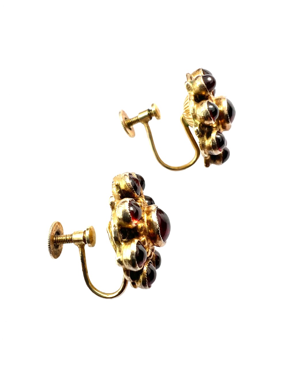 A pair of antique silver-gilt earrings set with deep red cabochon garnets arranged in a circular cluster halo design. View V