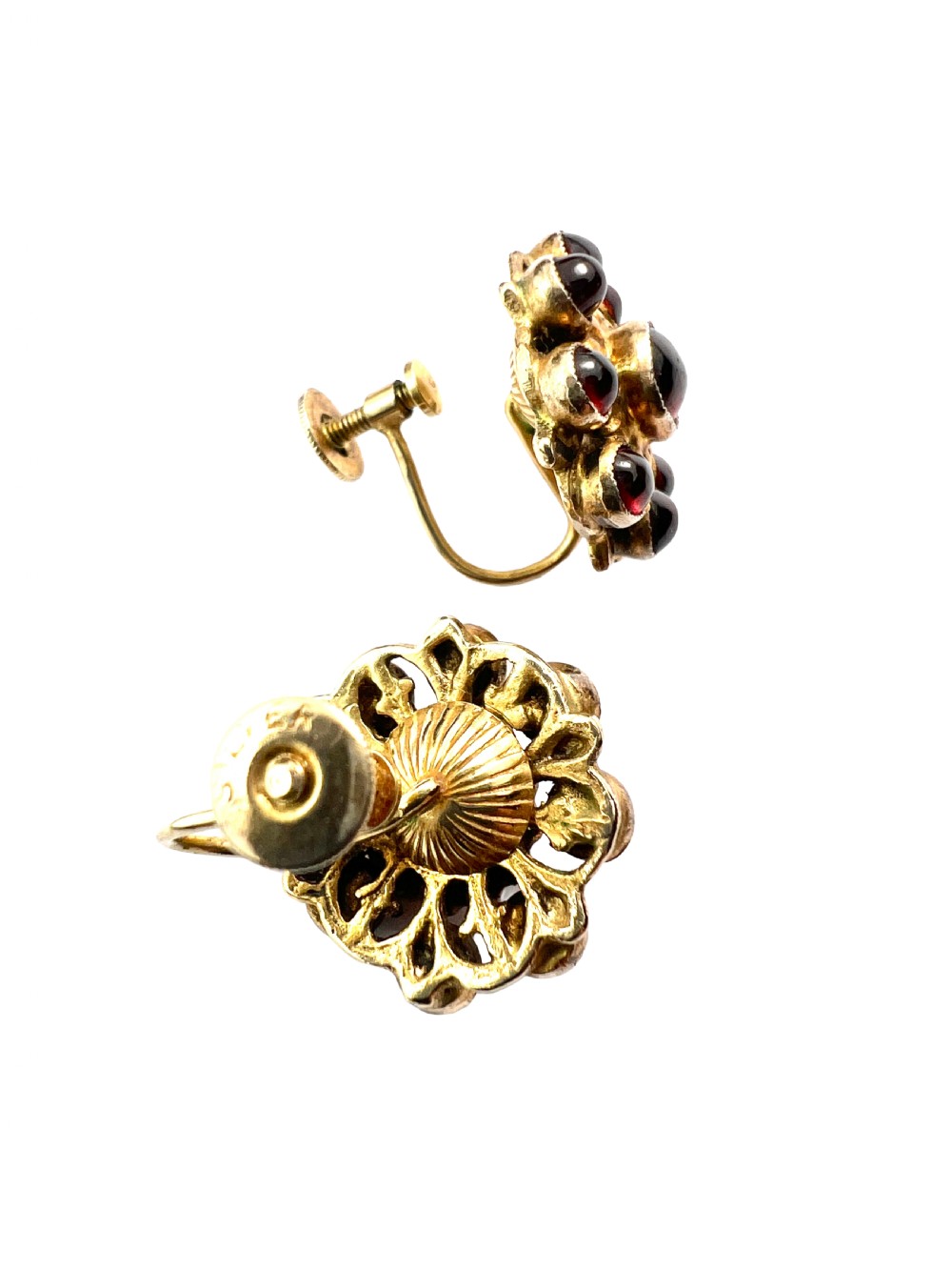 A pair of antique silver-gilt earrings set with deep red cabochon garnets arranged in a circular cluster halo design. View VI