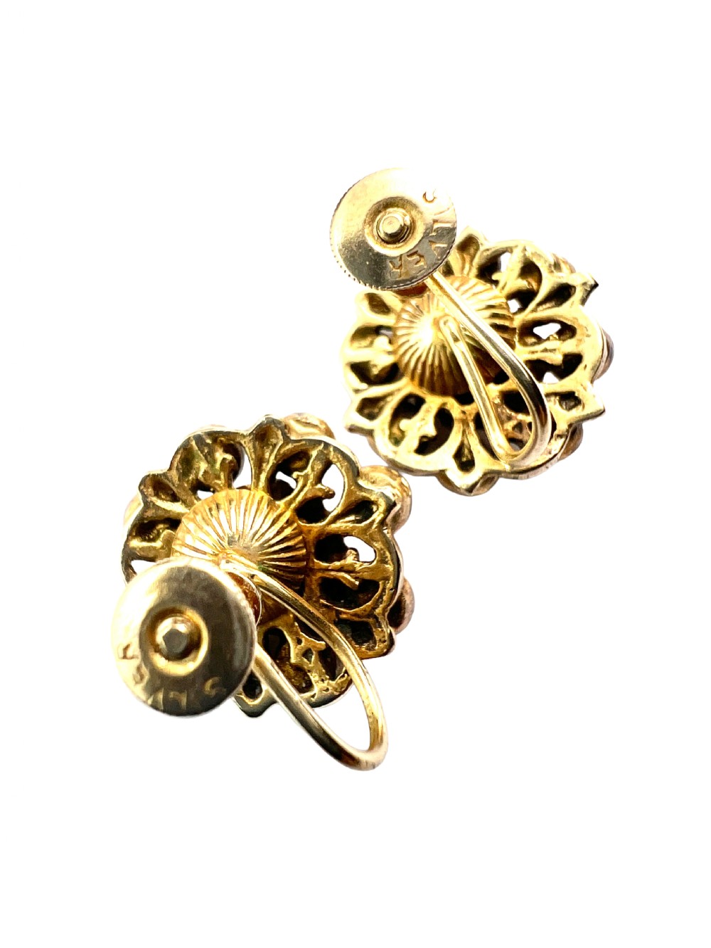 A pair of antique silver-gilt earrings set with deep red cabochon garnets arranged in a circular cluster halo design. View VII