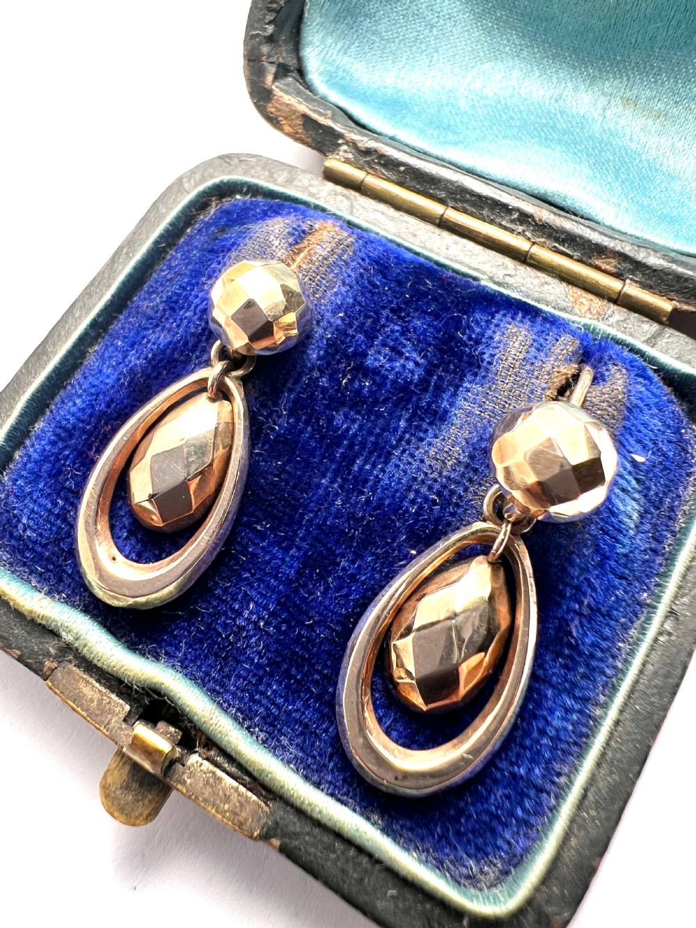 Pair of Victorian 9ct gold drop earrings featuring faceted top beads and suspended teardrops within oval hoops. View II