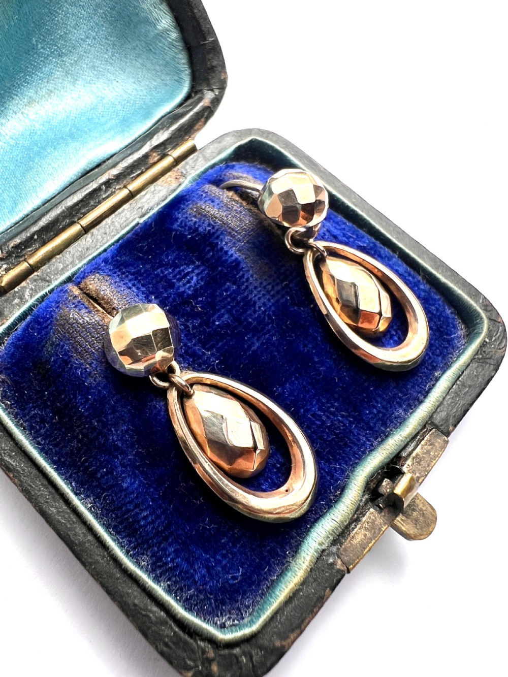 Pair of Victorian 9ct gold drop earrings featuring faceted top beads and suspended teardrops within oval hoops. View III