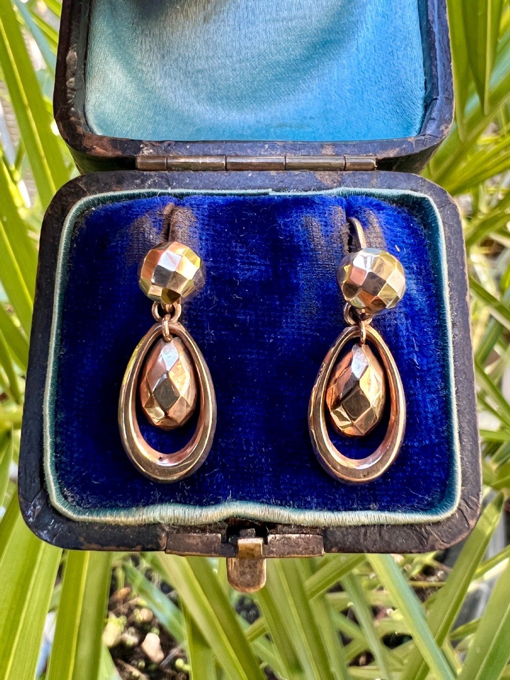 Pair of Victorian 9ct gold drop earrings featuring faceted top beads and suspended teardrops within oval hoops. View VIII