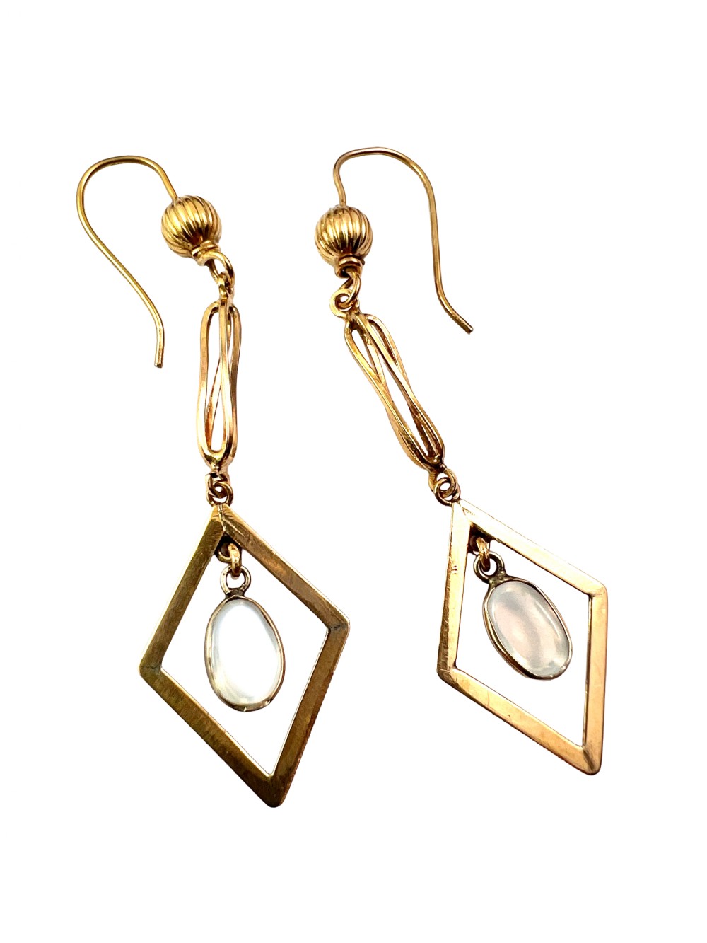 A pair of yellow gold drop earrings featuring ribbed shepherd hooks, linear twisted wire links, and open diamond-shaped frames containing oval moonstone cabochons. View III