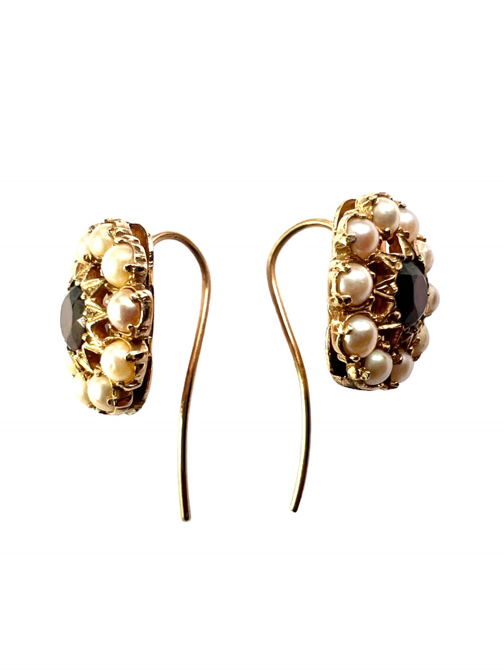 A pair of Victorian gold cluster earrings featuring a central round faceted red garnet surrounded by seed pearls set in a starburst pattern. View III