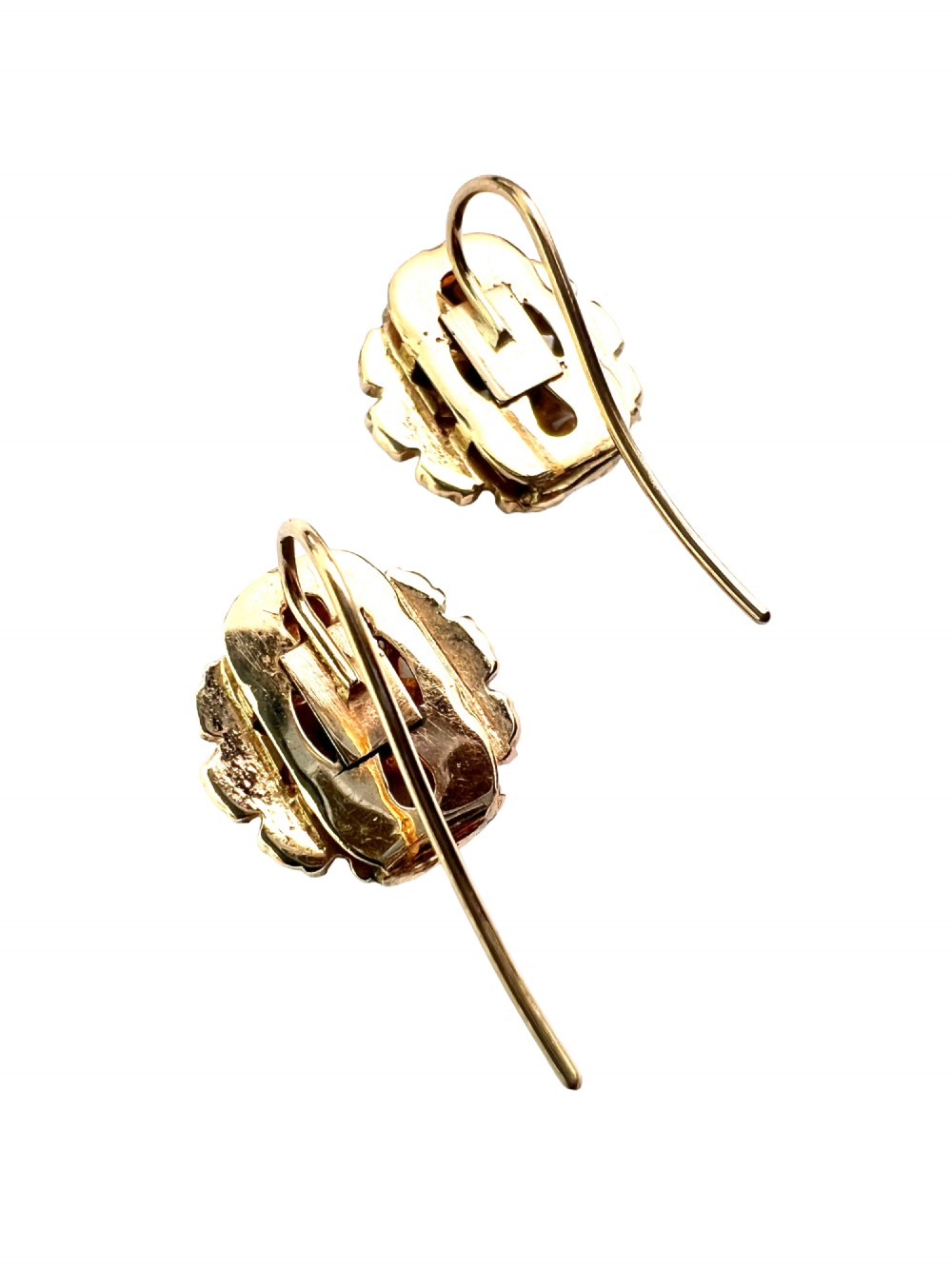 A pair of Victorian gold cluster earrings featuring a central round faceted red garnet surrounded by seed pearls set in a starburst pattern. View IV
