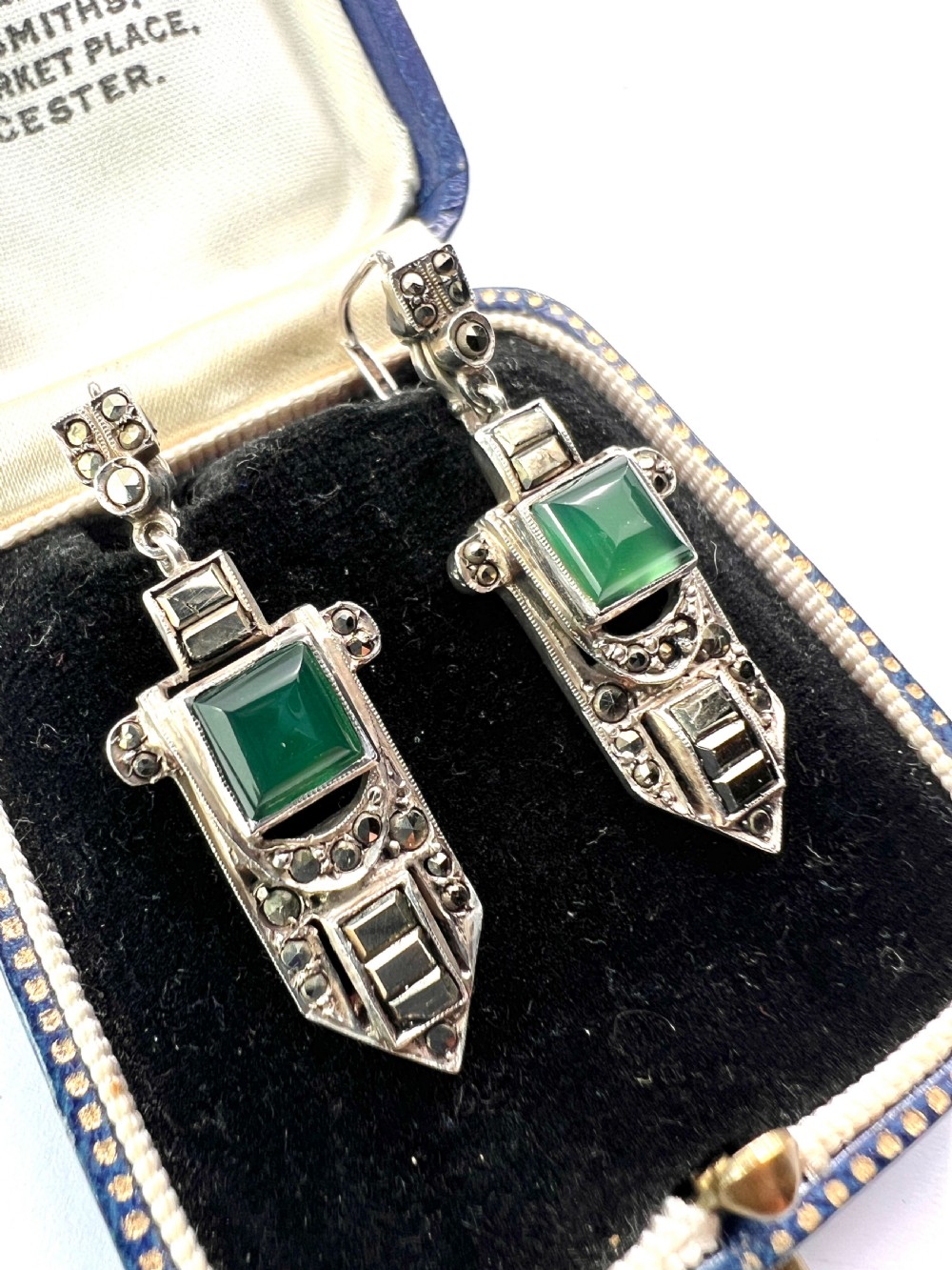 A pair of silver Art Deco drop earrings featuring square green chrysoprase cabochons within geometric stepped frames set with marcasite stones. View II