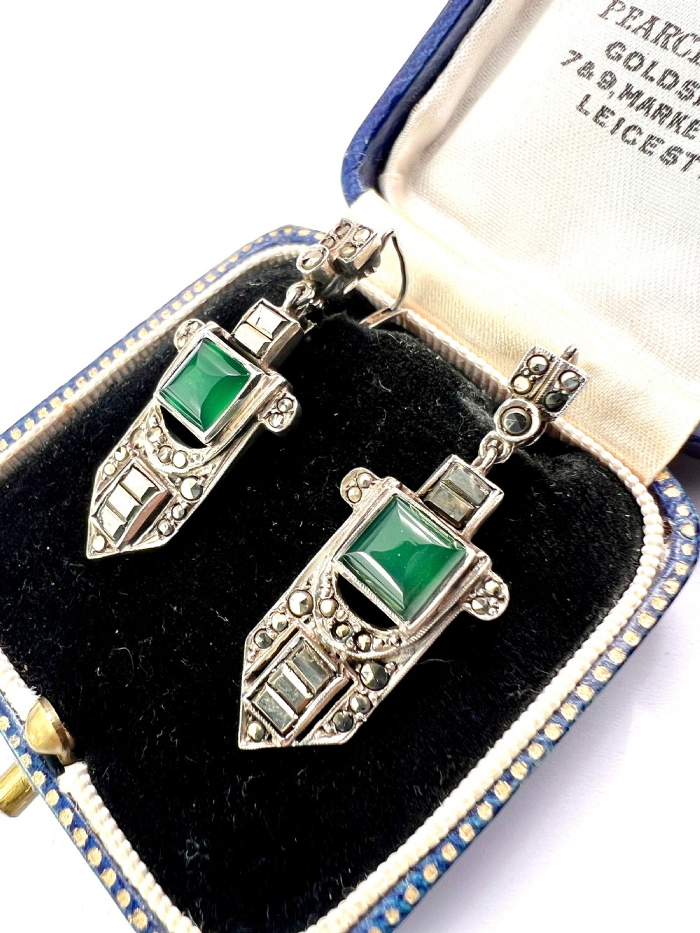 A pair of silver Art Deco drop earrings featuring square green chrysoprase cabochons within geometric stepped frames set with marcasite stones. View III
