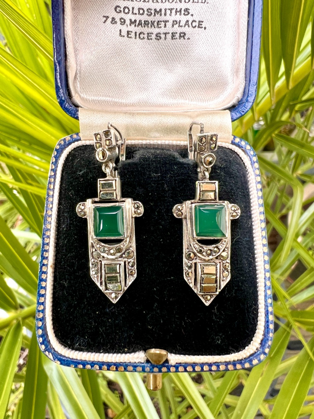 A pair of silver Art Deco drop earrings featuring square green chrysoprase cabochons within geometric stepped frames set with marcasite stones. View VII