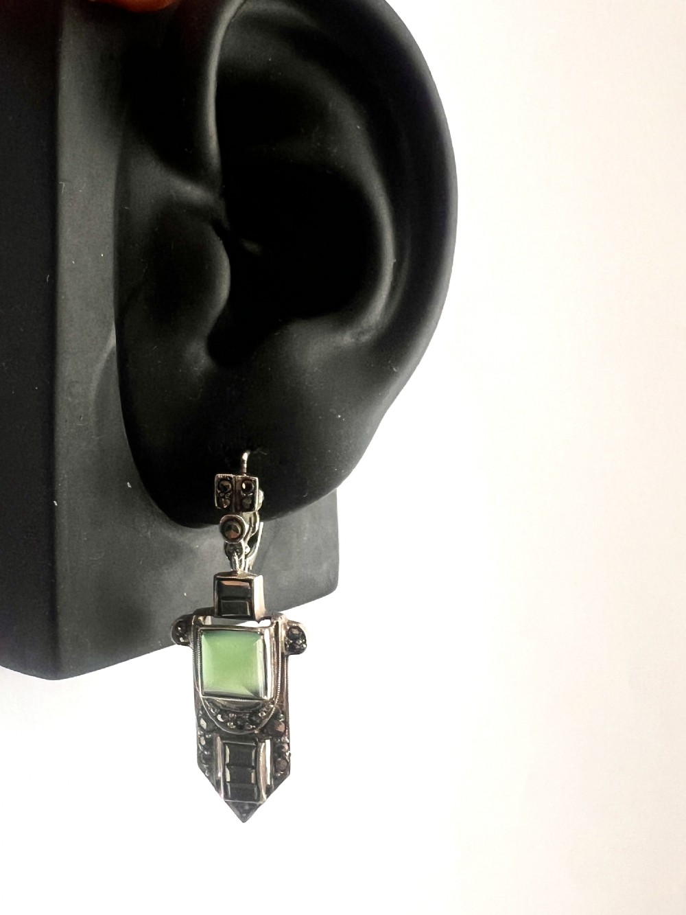 A pair of silver Art Deco drop earrings featuring square green chrysoprase cabochons within geometric stepped frames set with marcasite stones. View VIII