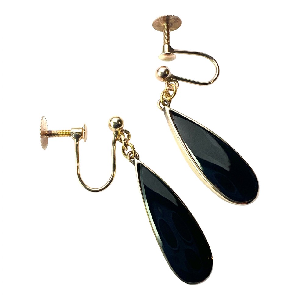 A pair of vintage 9ct yellow gold drop earrings featuring elongated black onyx teardrops suspended from screw-back fittings. View II