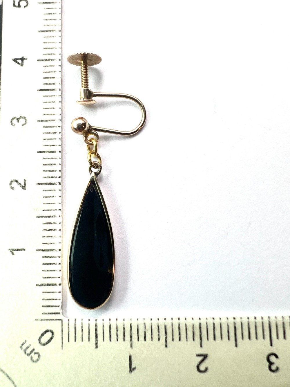 A pair of vintage 9ct yellow gold drop earrings featuring elongated black onyx teardrops suspended from screw-back fittings. View V