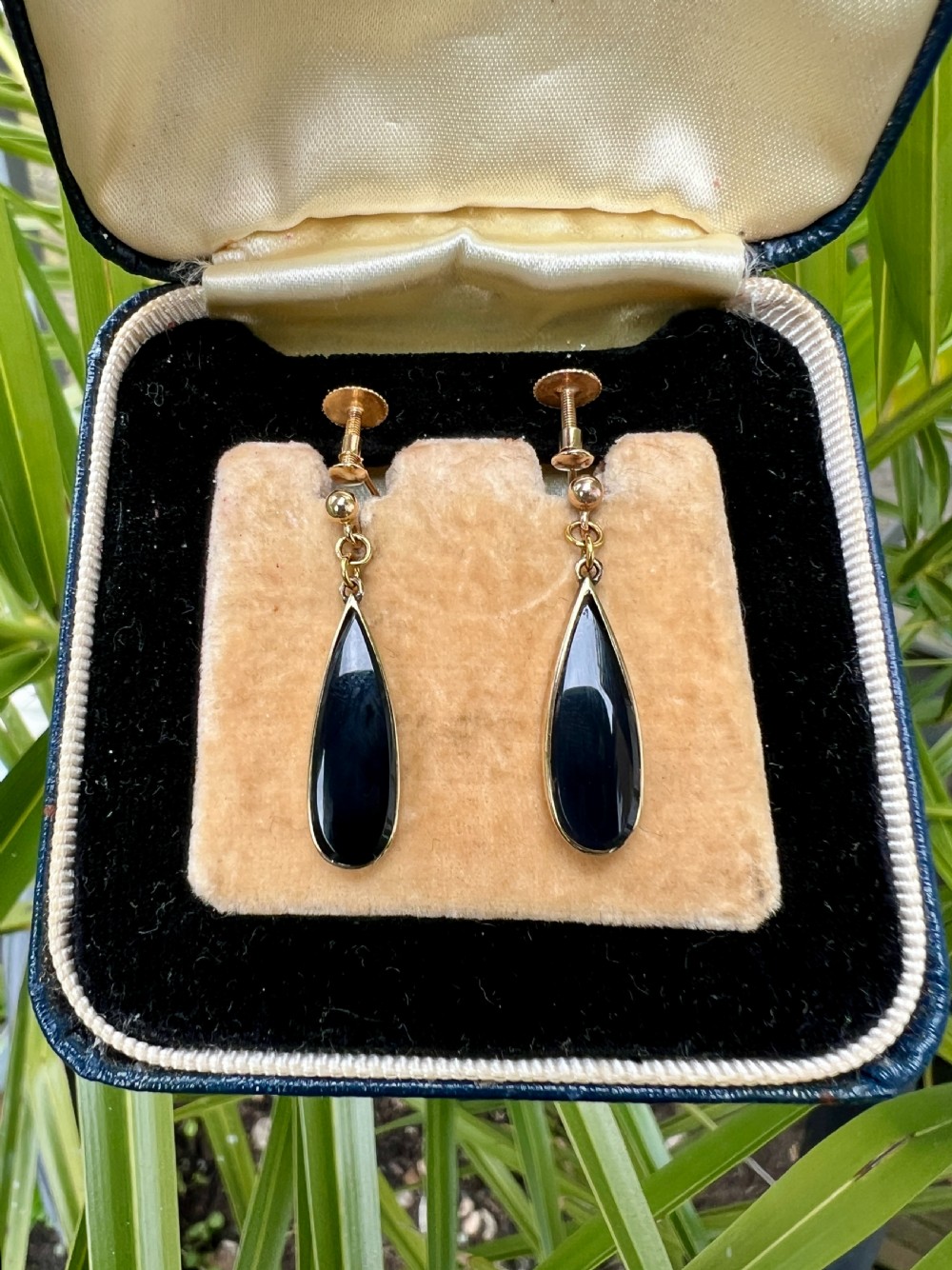A pair of vintage 9ct yellow gold drop earrings featuring elongated black onyx teardrops suspended from screw-back fittings. View VI