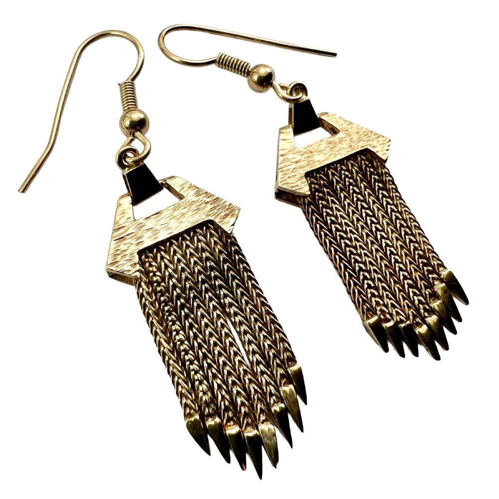 A pair of vintage 9ct gold drop earrings featuring textured geometric caps suspending multiple foxtail chain tassels with pointed tips. View II