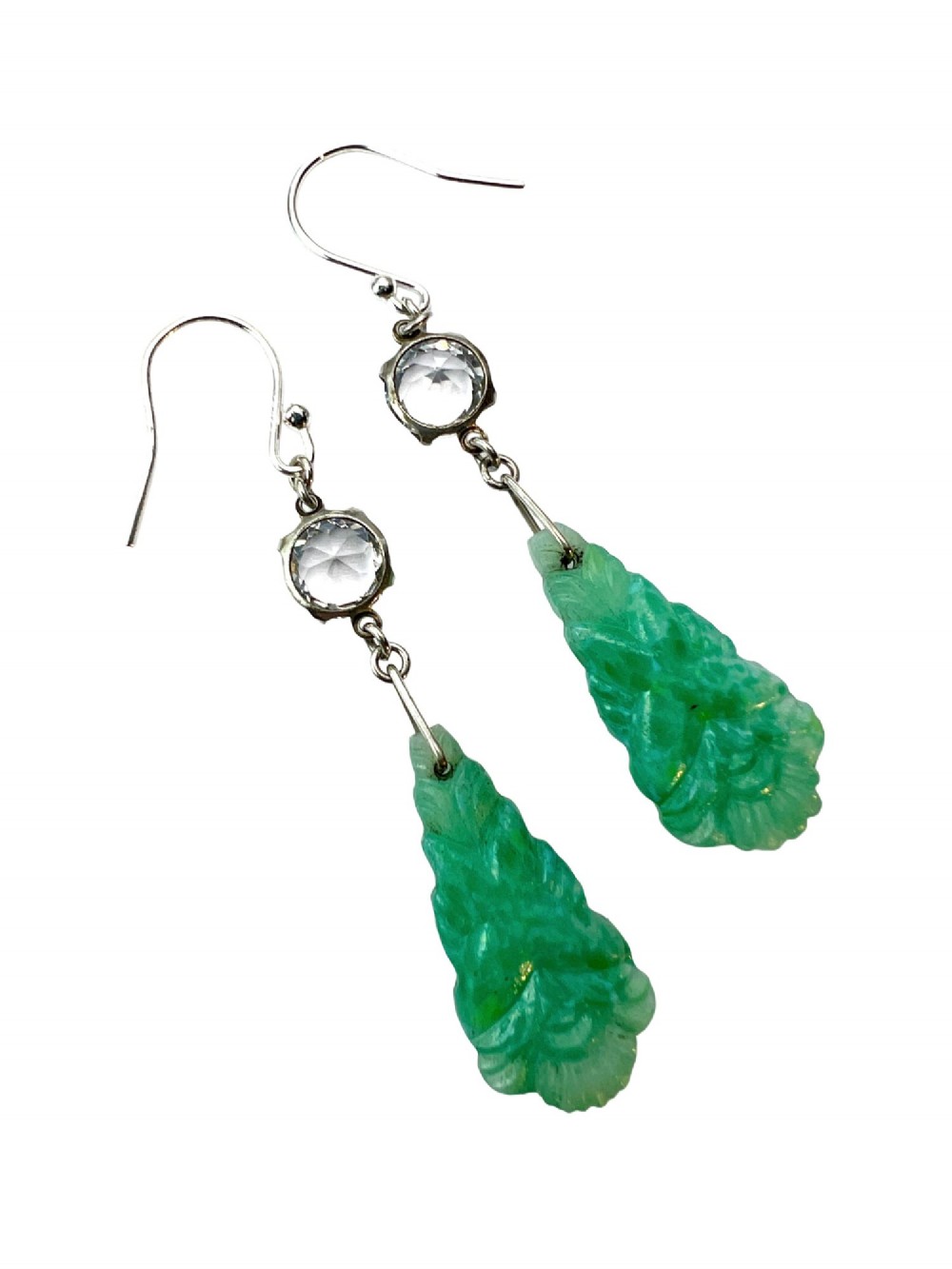A pair of silver drop earrings featuring clear round crystals above carved green glass teardrop pendants. View V