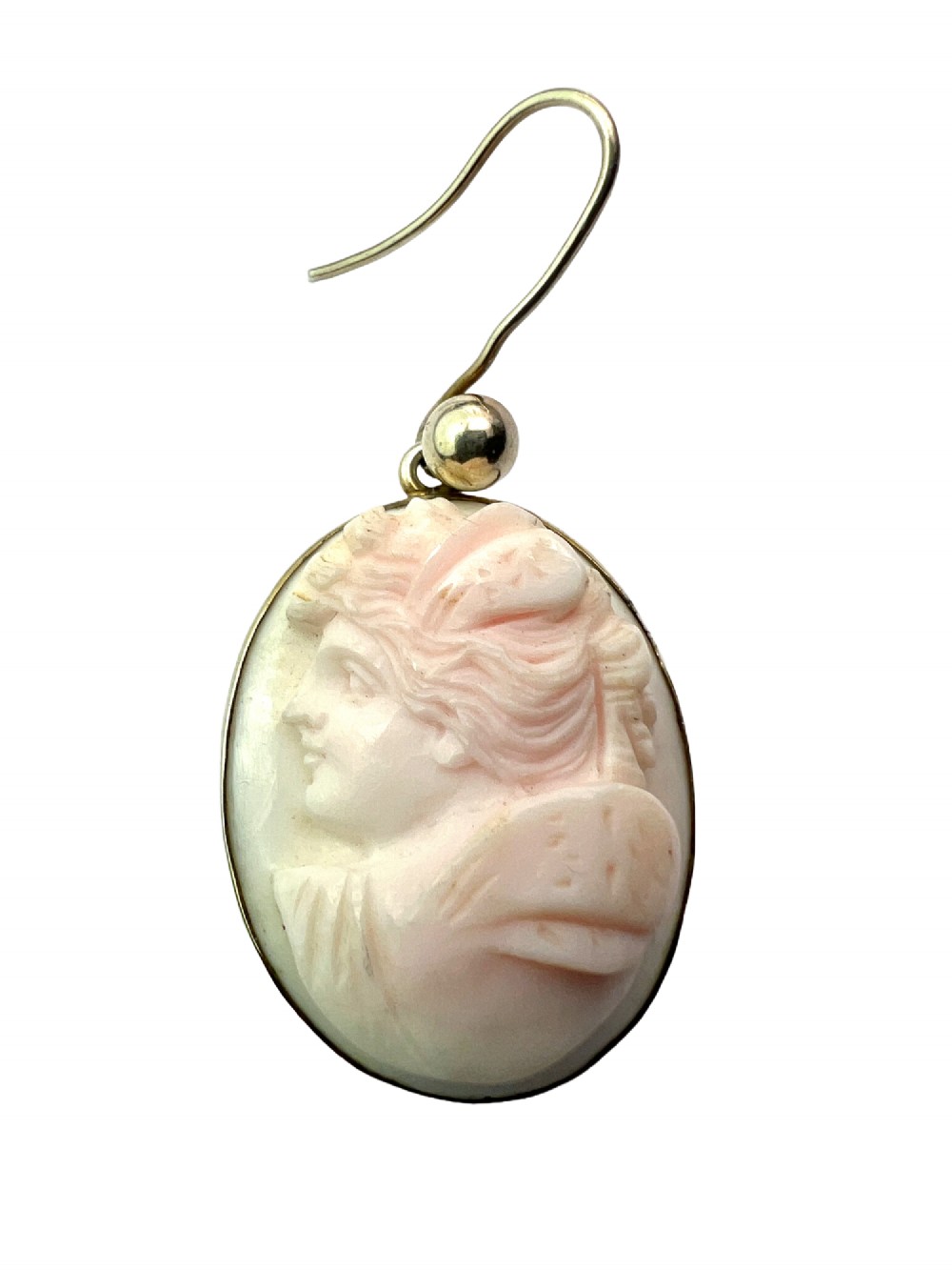 A pair of oval drop earrings featuring carved pink and white queen conch shell cameos depicting classical profile portraits set in silver mounts. View III