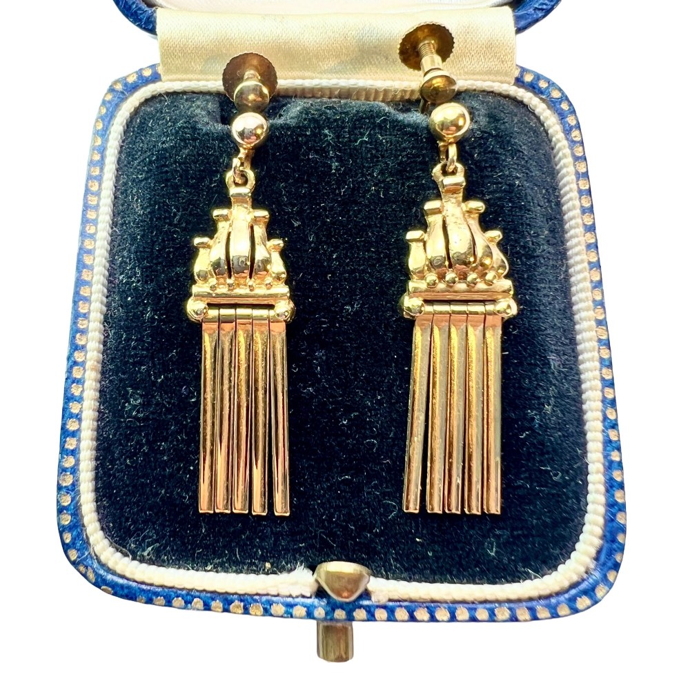 A pair of vintage 9ct yellow gold drop earrings featuring articulated fringe tassels suspended from decorative caps with screw-back fastenings.