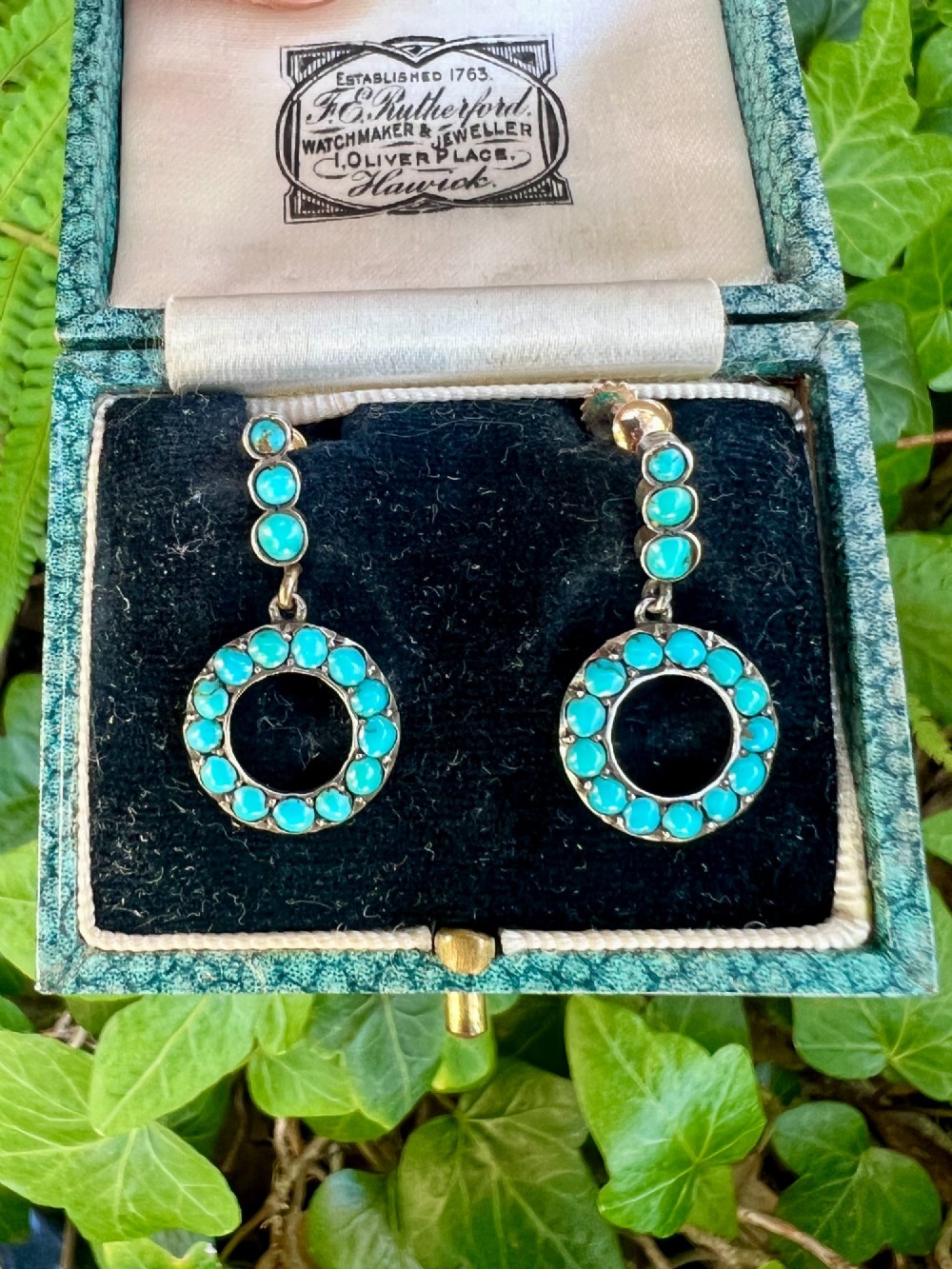 A pair of Victorian gold and silver drop earrings featuring circular open-hoop motifs set with small turquoise cabochons. View VIII