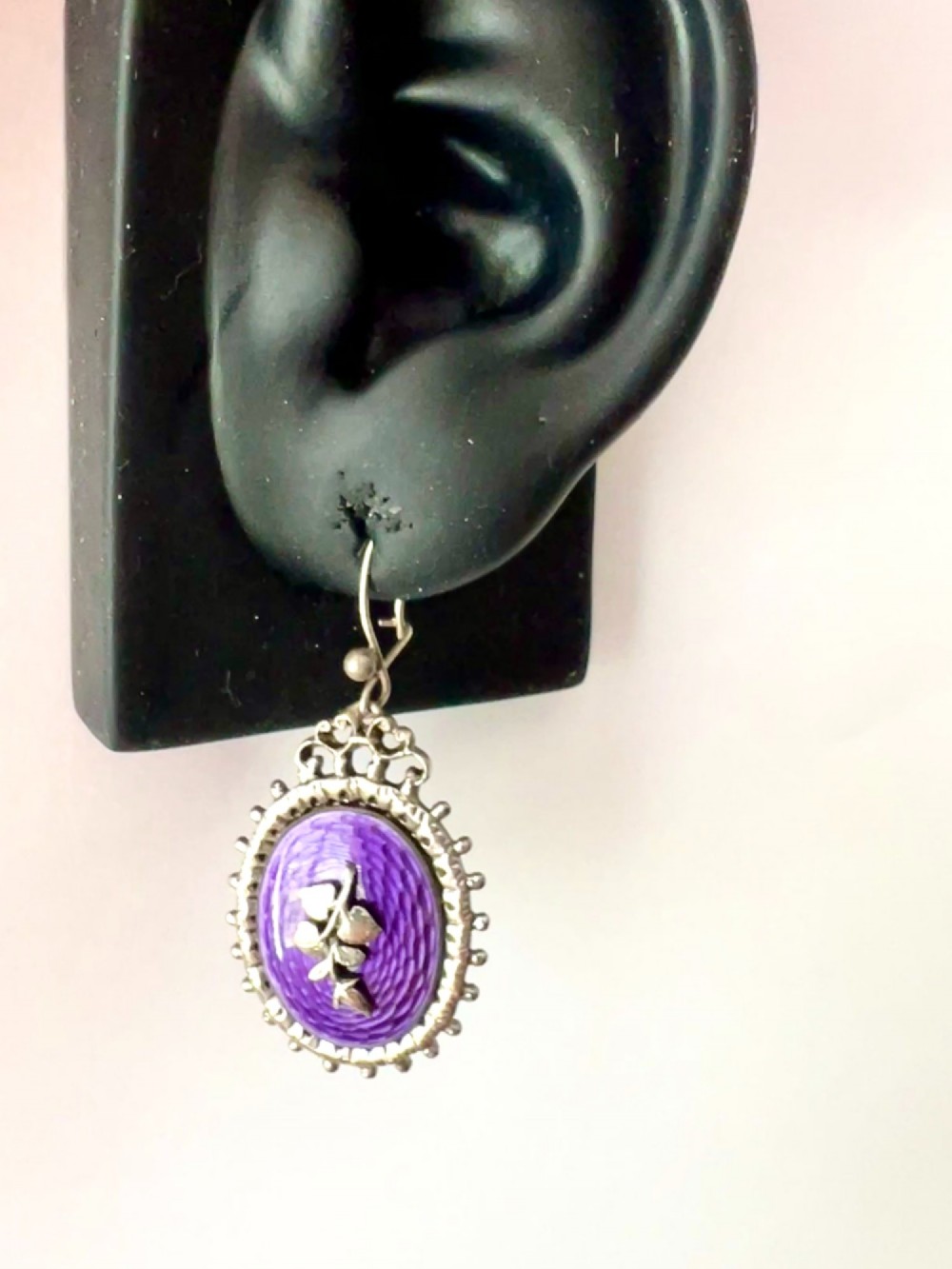 A matching silver jewellery set featuring purple guilloche enamel panels decorated with silver leaf motifs, including drop earrings, a ring, and an articulated link bracelet. View IX