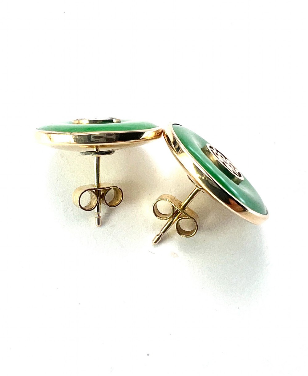 Pair of circular green jade torus stud earrings with central fourteen-carat gold character medallions. View VI