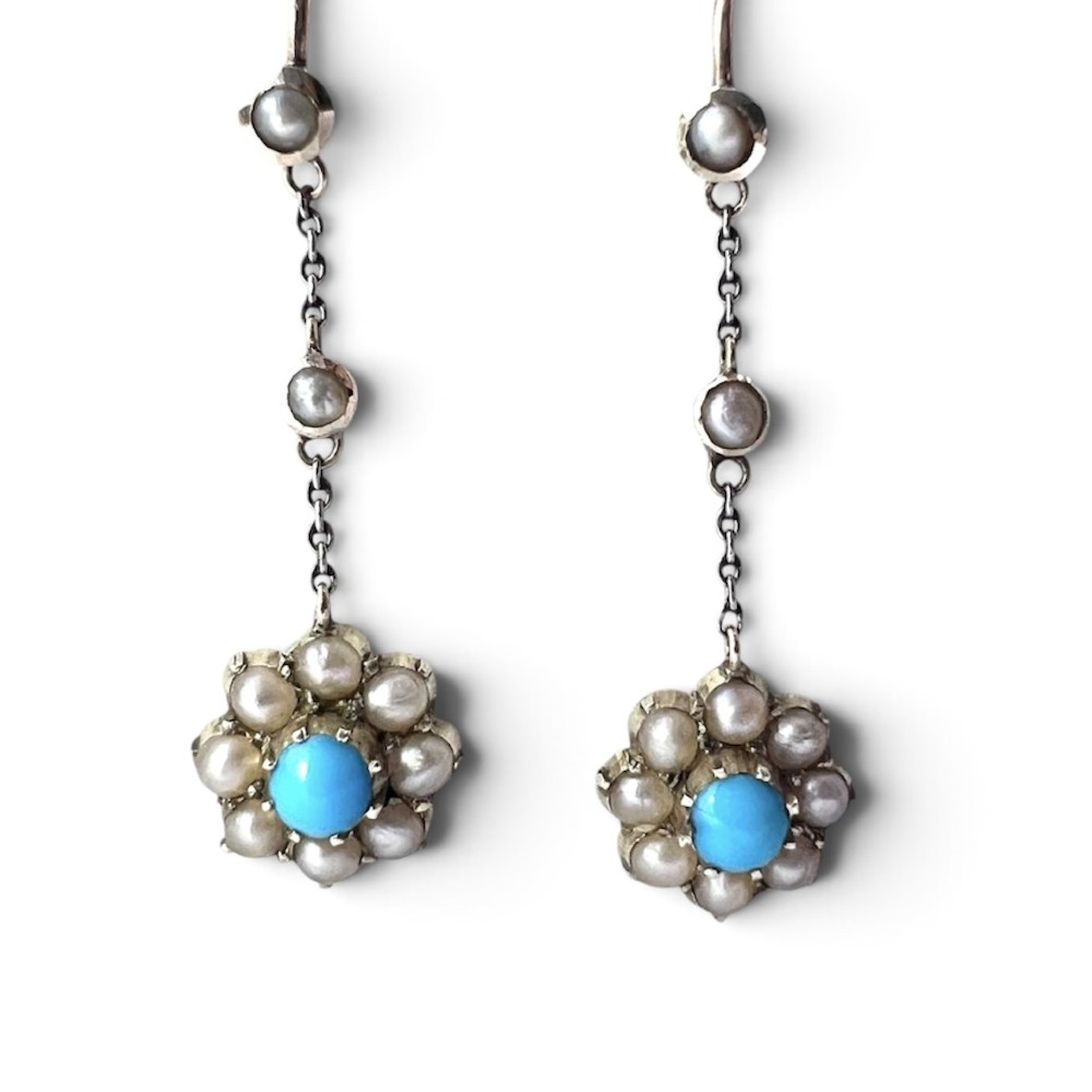 A pair of Edwardian gold drop earrings featuring floral cluster pendants set with central turquoise cabochons surrounded by pearls. View III