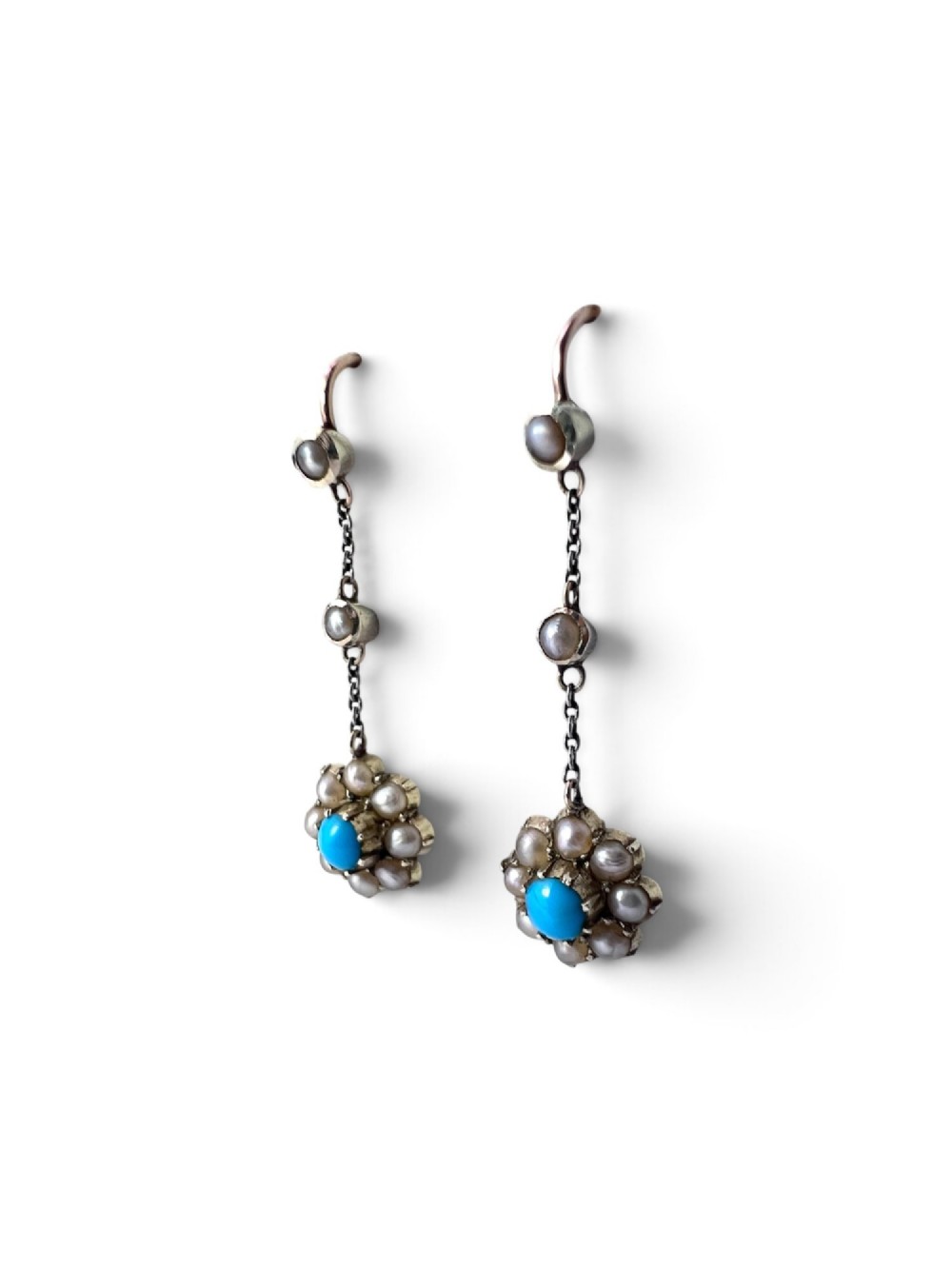 A pair of Edwardian gold drop earrings featuring floral cluster pendants set with central turquoise cabochons surrounded by pearls. View IV