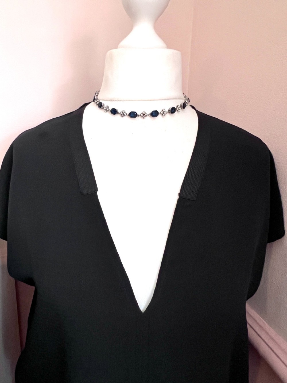 An Art Deco silver jewellery set comprising a link necklace and drop earrings with octagonal blue paste stones and clear cluster links. View VI