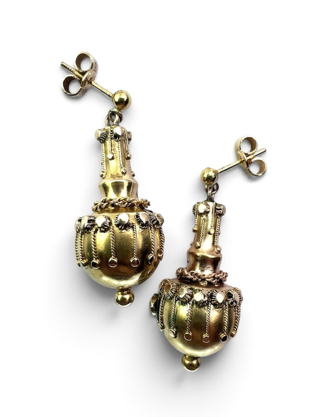 A pair of Victorian 15ct yellow gold Etruscan Revival drop earrings featuring amphora-shaped pendants embellished with granulation wirework and central gemstones. View II