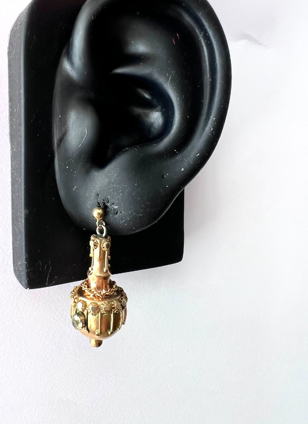 A pair of Victorian 15ct yellow gold Etruscan Revival drop earrings featuring amphora-shaped pendants embellished with granulation wirework and central gemstones. View VI