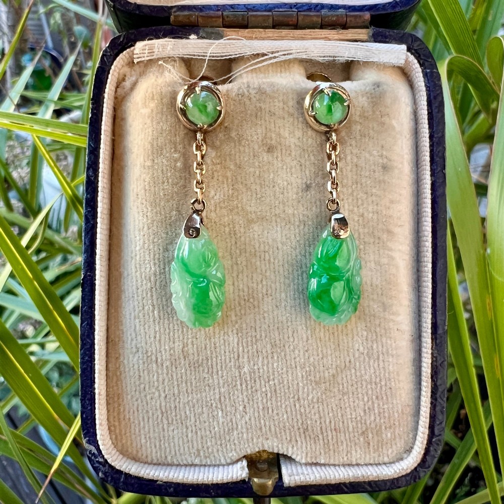 A pair of Art Deco 14ct gold drop earrings featuring circular green jade cabochons at the top connected by short chain links to teardrop-shaped carved green jade pendants. View VIII