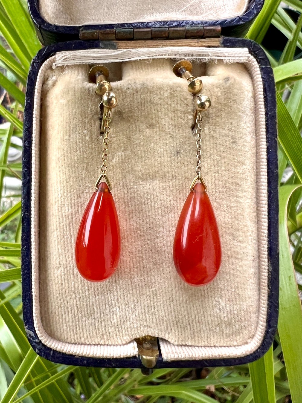 Pair of Edwardian 9ct gold screw-back earrings featuring delicate chains suspending polished teardrop-shaped red agate drops. View VIII