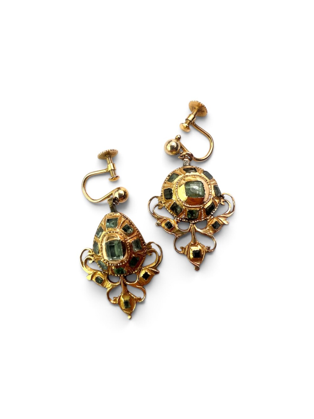 A pair of ornate Georgian yellow gold drop earrings featuring central step-cut green gemstones surrounded by smaller accent stones and scrollwork flourishes. View IV